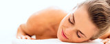 Relaxed young woman on massage table