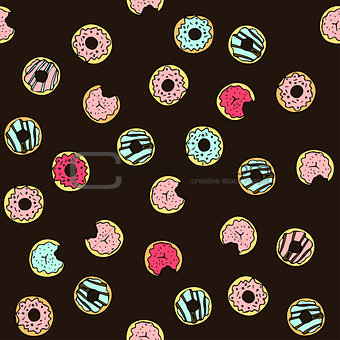 Seamless vector pattern with doodle hand drawn donuts.