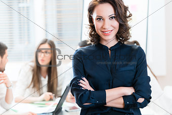 Manager with her team working in the office