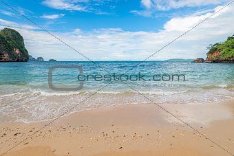 Sandy beach and turquoise sea in a tropical place of Thailand