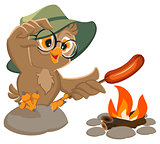 Picnic owl scout frying sausage on fire