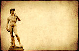 Grunge background with paper texture and statue of Michelangelo'