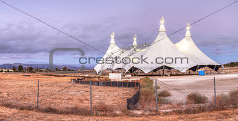 Sunset over a large circus tent