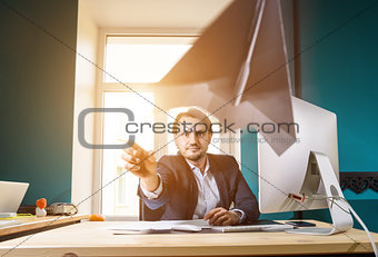 Businessman throwing paper airplane