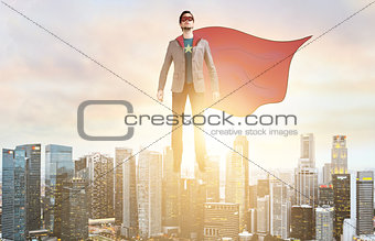 Business super hero hover over city skyline