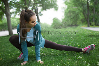 Portrait of young and sporty woman in sportswear doing yoga or Stretching exercises