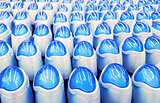 Deodorant, bottles with blue lids in a row.