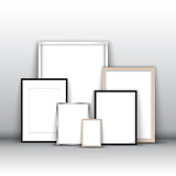 Blank picture frames against a wall