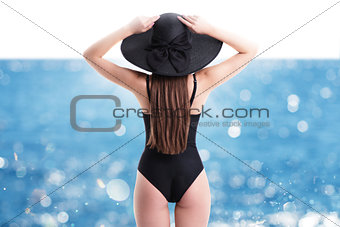 Woman with straw hat at sea