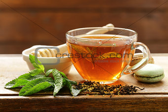 Refreshing tea with mint in a cup on the table