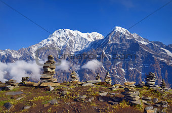Mountain Landscape in Himalaya. Piramid of stones. Annapurna South peak, Hiun Chuli.