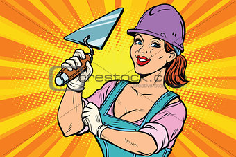 Construction worker with trowell. Woman professional