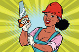 Construction worker with saw. Woman professional