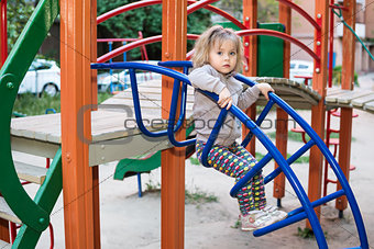 Girl on the stairs at playground