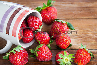 Fresh ripe strawberries in mug