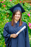 Graduated young woman smiling at camera