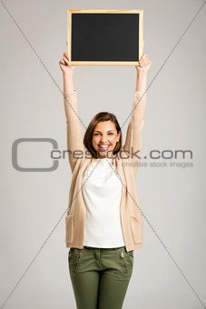 Woman showing something on a chalkboard