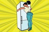 diet and food. Beautiful woman hugging home refrigerator