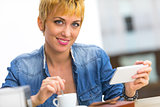 Young woman enjoying a cup of coffee