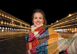 tourist woman at San Marco square in Venice taking selfie