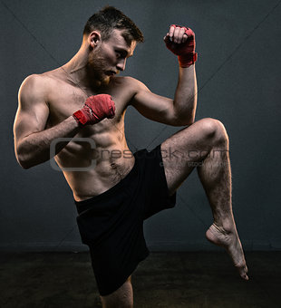 Bearded fighter during hard workout