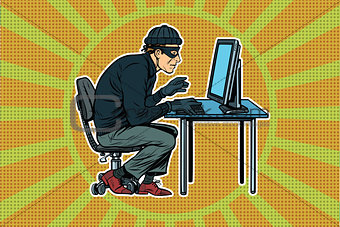 hacker sitting at the computer