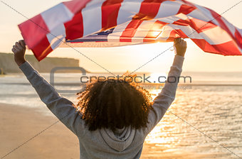 Mixed Race African American Girl Teenager With US Flag Beach at 