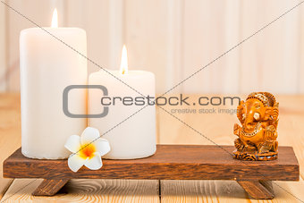 statue of the Hindu god Ganesha and religious candles