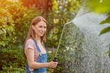 Gardeners watering plants