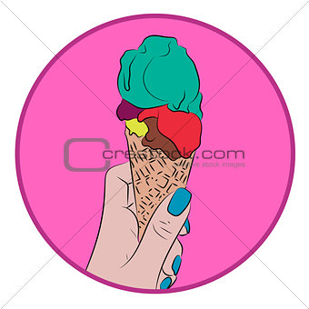 Hand holds a waffle cone with a colorful balls of an ice cream