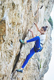 woman rock climber on the cliff