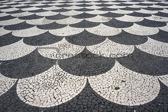 Mosaic tiles pavement pattern in Funchal, Madeira, Portugal. 