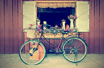 Old bicycle and flowers in vintage style