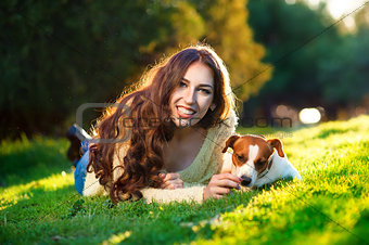 Beautiful woman playing with her dog Jack Russell Terrier. Outdoor portrait. series