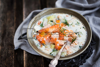 Hot salmon and shrimps cream soup