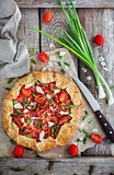 Delicious homemade rustic open pie (galette) with tomato, cheese