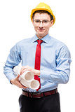 Young architect in a shirt wearing a yellow hard hat, portrait o