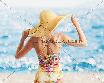 Girl at the beach with a bright sea