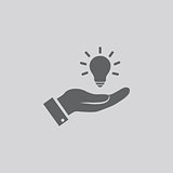Light bulb in hand icon