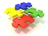 Four colorful jigsaw puzzle pieces set apart