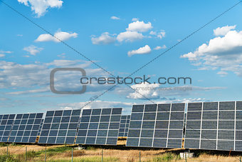 Solar power plant with a cloudy sky