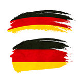 Grunge brush stroke with Germany national flag on white