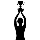 Silhouette of a woman holding a championship trophy