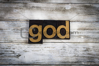 God Letterpress Word on Wooden Background
