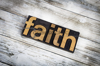 Faith Letterpress Word on Wooden Background