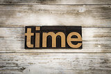Time Letterpress Word on Wooden Background