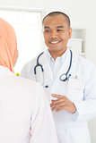 Medical doctor discussing with nurse