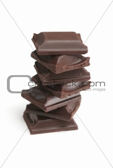 It is a lot of segments of chocolate on a white background