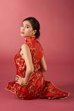 Chinese girl in red cheongsam