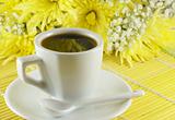 Fresh cup of coffee with flowers